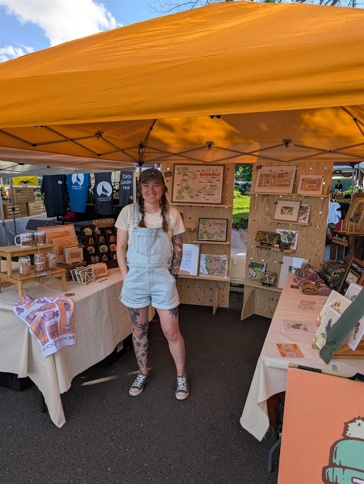 Madison at her art booth at a Spokane market